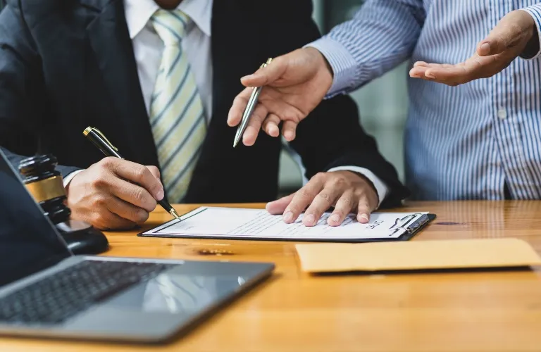 Lawyer and client are reviewing documents