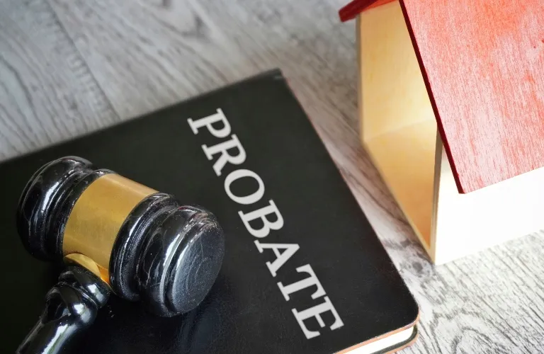 Toy house, judge's gavel and Probate book