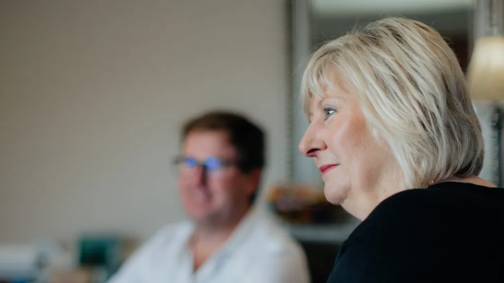 Two people listening during a first estate planning meeting at a conference table
